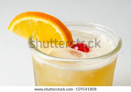 Whiskey Sour With Cherry and Orange Slice