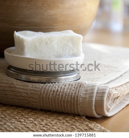 Pure Olive Oil Soap with towel, neutral tones.