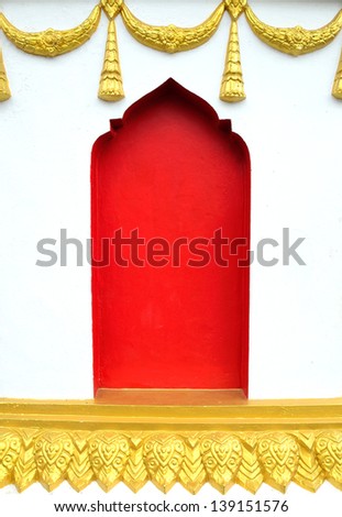 Red and white wall of the temple in Thailand