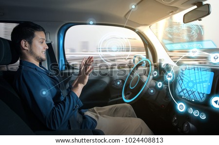 relaxed man in autonomous car. self driving vehicle. autopilot. automotive technology.