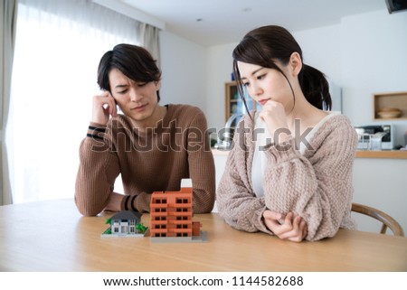 Young couple thinking about residence.