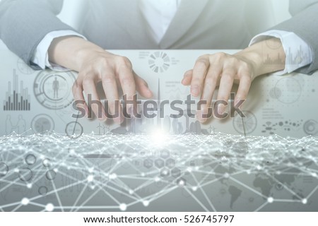 woman looks transparent monitor panel that indicates technological graphics IoT(Internet of Things), ICT(Information Communication Technology), digital transformation, abstract image visual