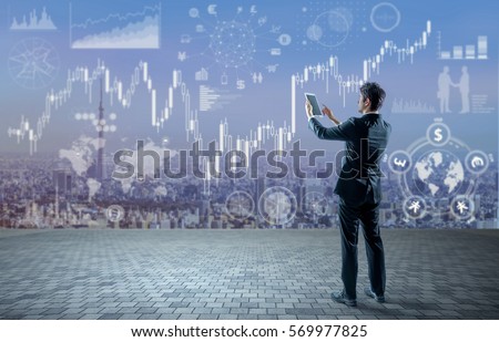 young businessman holding tablet PC and financial technology concept, FinTech, Block Chain, abstract image visual
