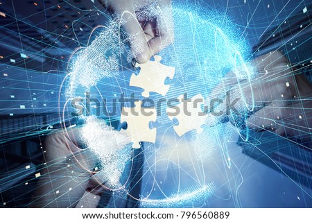 Pieces of jigsaw puzzle and global network concept.