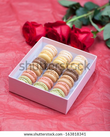 Macaroon on a paper background with roses
