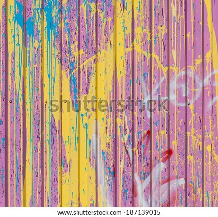 the background texture is multi color red gray green yellow blue gray, metal leaf, a profile