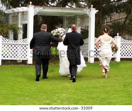 People running from the rain taking formals at a summer wedding.