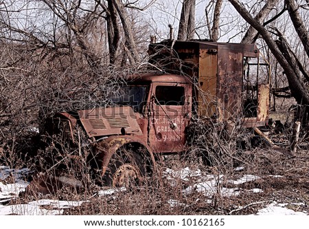 an old delivery truck abandoned on a farm