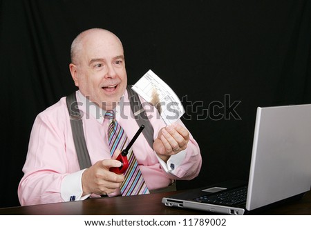 business man in a pink shirt lighting his paycheck on fire