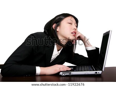 asleep at computer. stock photo : young businesswoman asleep at her computer