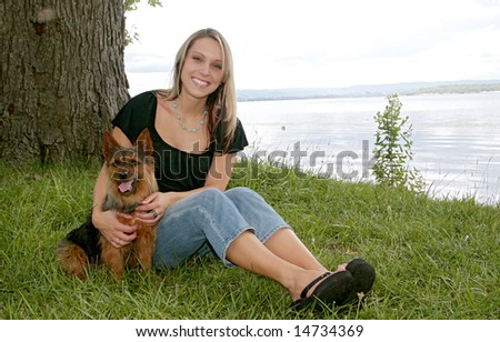 one woman and her pet dog playing in the park