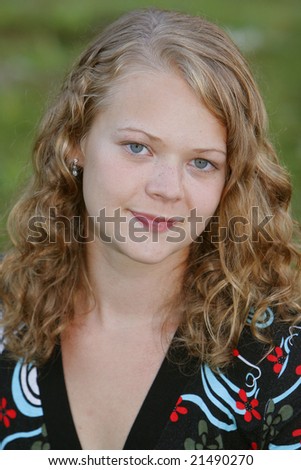 stock photo one young blonde teen model posing outdoors closeup portrait