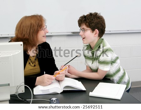 one adult female teacher and a young student learning in class