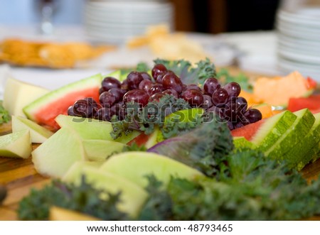  variety of fruit including grapes and watermelon at a wedding reception