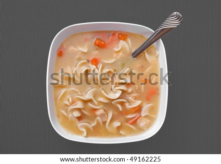one simple bowl of plain chicken noodle soup in a white bowl on a grey background