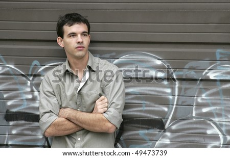 one twenties young guy thinking outdoors looking contemplative
