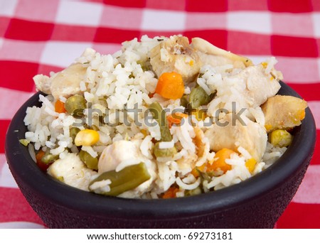 bowl of chicken and rice with mixed vegetables