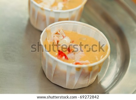 small lobster soup in a paper cup