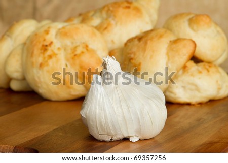 one garlic bulb and small stack of garlic bread