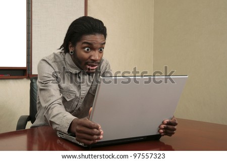 very unhappy or stressed business guy looking at a laptop