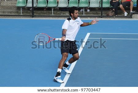 MELBOURNE, AUSTRALIA - JANUARY 21: professional tennis player Aisam Ul Haq Qureshi hits a forehand at the 2012 Australian Open, in Melbourne Australia January 21, 2012.