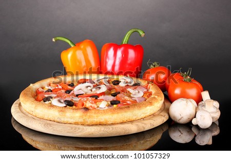 Aromatic pizza with vegetables and mushrooms isolated on black