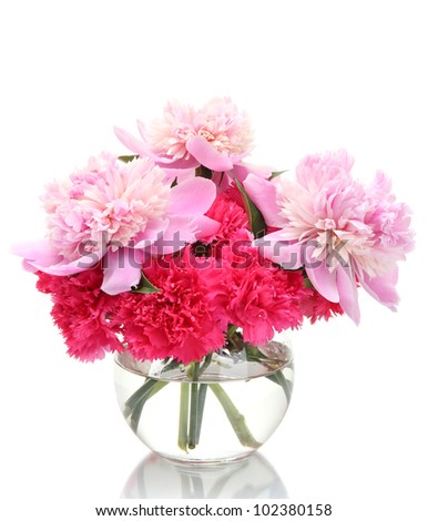 Bouquet of carnations and peonies in glass vase isolated on white