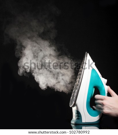 Electric iron with steam on black