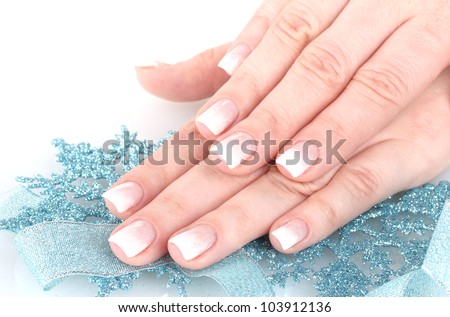 hands with beautiful winter design, snowflakes and ribbon isolated on white