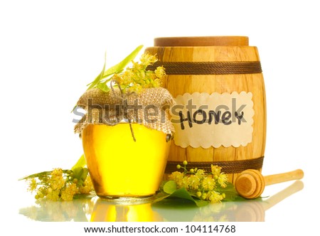 jar and barrel with linden honey and flowers isolated on white