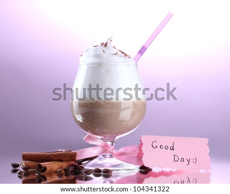 glass of coffee cocktail on purple background