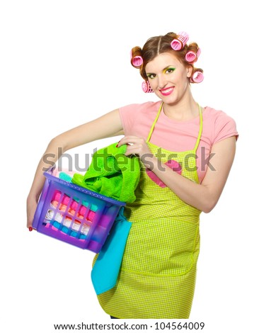 beautiful young housewife with basket of folded laundry isolated on white