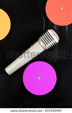 Black vinyl record and microphone close-up