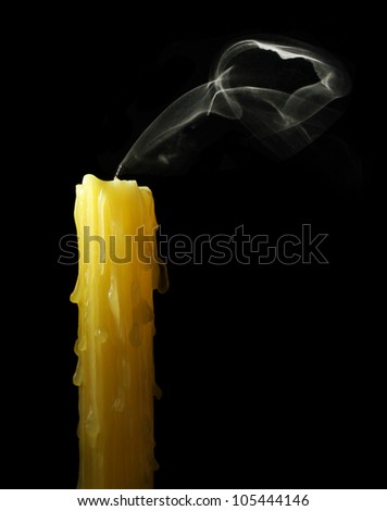 candle with abstract smoke on black background