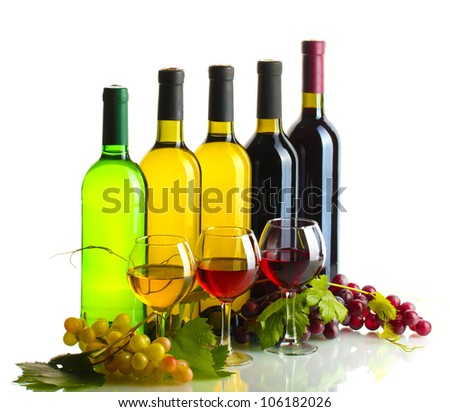 bottles and glasses of wine and ripe grapes isolated on white