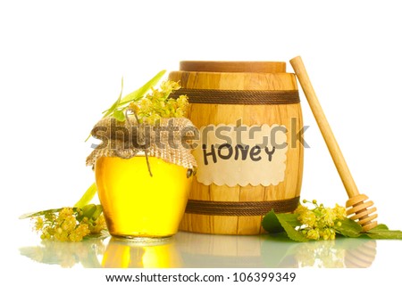 jar and barrel with linden honey and flowers isolated on white