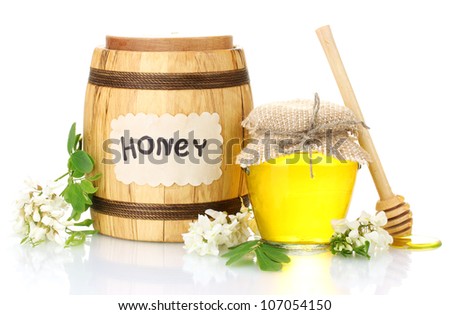 Sweet honey in barrel and jar with acacia flowers isolated on white