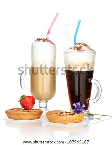 glasses of coffee cocktail with tarts on doily, strawberry and flower isolated on white