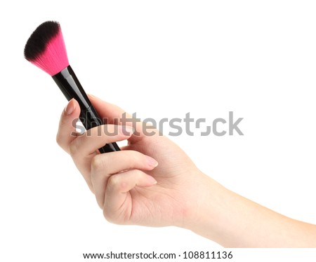 hand with black brush for make-up  isolated on white