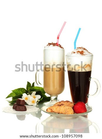 glasses of coffee cocktail with sweets and flower isolated on white