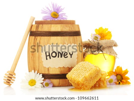Sweet honey in jar and barrel with honeycomb, wooden drizzler and flowers isolated on white