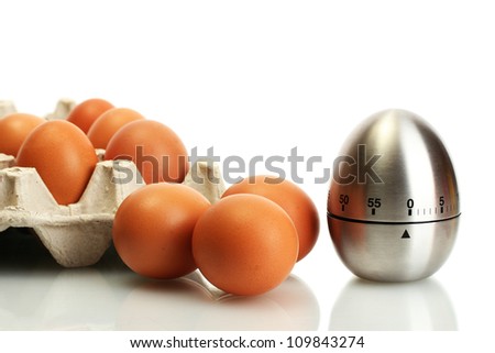 eggs in box and egg timer isolated on white