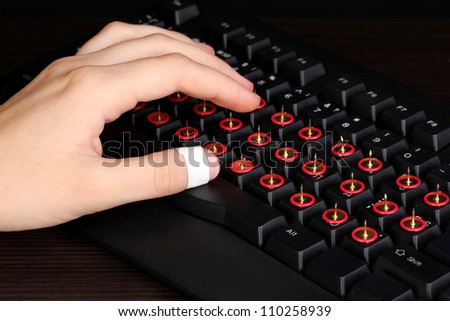 Painful typing on keyboard close-up