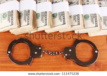 idea of punishment for financial fraud, on wooden background