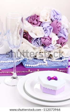 Serving fabulous wedding table in purple color isolated on white