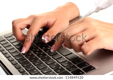business woman\'s hands typing on laptop computer, on white background close-up