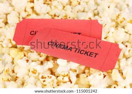 cinema tickets on popcorn background