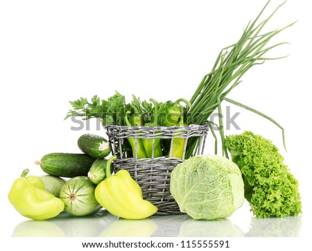 fresh green vegetables in basket isolated on white
