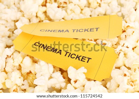 cinema tickets on popcorn background