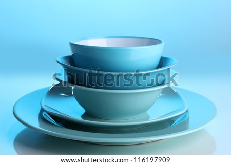 Blue tableware on blue background